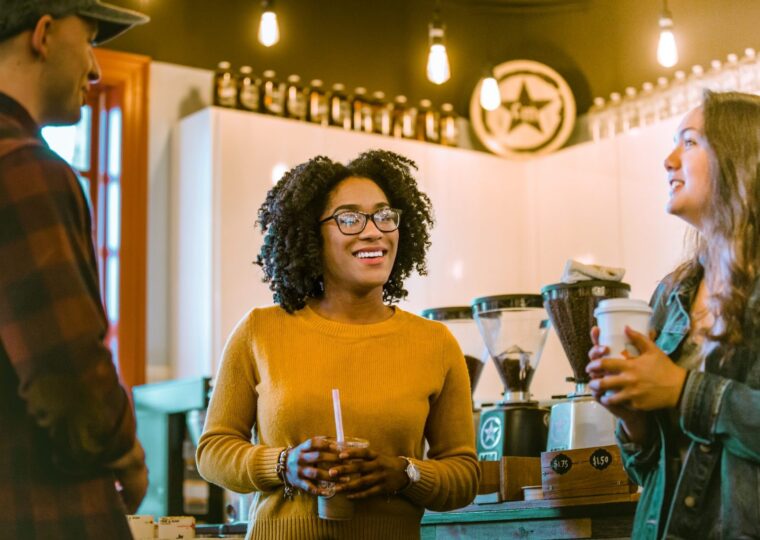 Students in conversation at a campus coffee shop